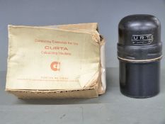 Curta type II mechanical calculator, serial number 520507, in original metal canister together