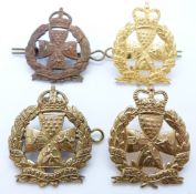 Four British Army Inns of Court Regiment metal cap badges, one an officer's gilt example