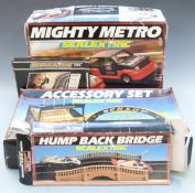 Four Hornby Scalextric model motor racing sets and accessories comprising Mighty Metro Racing Set