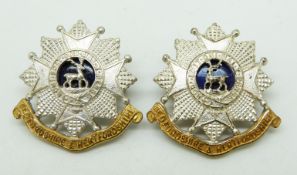 Two British Army Bedfordshire and Hertfordshire Regiment officer's metal collar badges, one