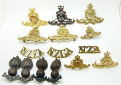 Fifteen New Zealand Army Artillery metal cap badges, collar badges and shoulder titles including a