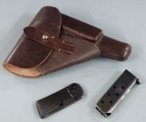 Walther PP pistol holster stamped to the inside, and two magazines.