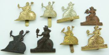 Eight British Army Norfolk Regiment metal cap badges