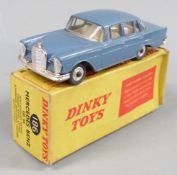 Dinky Toys diecast model Mercedes Benz 220 SE with blue body and cream interior, 186, in original