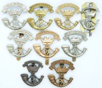 Nine British Regiment Somerset Light Infantry metal badges including four Somerset Battalion