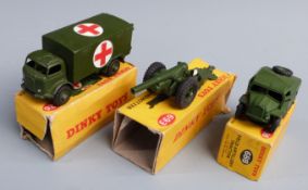 Three Dinky Toys diecast model vehicles Military Ambulance 626, Field Artillery Tractor 688 and 7.