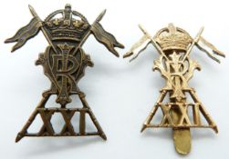 Two British Army 21st Lancers metal cap badges