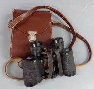 A pair of Carl Zeiss Jena Jenoptem 8x30w binoculars in leather case