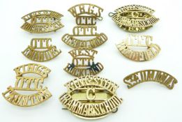 Ten schools/college Officer Training Corps metal shoulder titles including Bradfield, Emanuel,