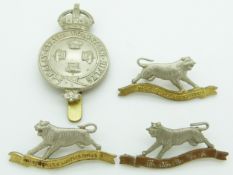 Malay States Volunteer Regiment metal cap badge and a pair of collar badges, plus one other