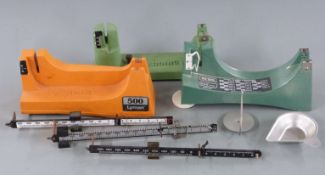 Three sets of shotgun cartridge reloading powder scales comprising Lyman 500, RCBS and one other.