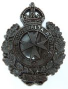 British Army King's Own Malta Regiment economy plastic cap badge, A Stanley & Sons Walsall to