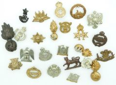 Small collection of British Army metal badges including 14th King's Hussars, 20th King's Hussars,