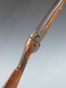 Percussion hammer action gun with chequered grip, vacant cartouche to the underside of the stock,