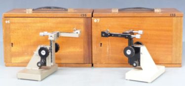 Two Beck, London magnifier platforms, both in wooden carry cases, together with two vernier