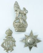 Three British army Dragoon Guards metal NCO arm badges