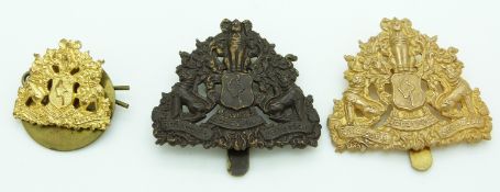 Three Burmese Army metal cap badges and a collar badge, two by Firmin London