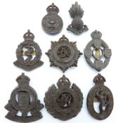 Eight British Army Corps economy plastic cap badges including R.E.M.E. Army Service Corps etc