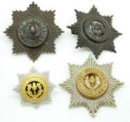 Four British Army Cheshire Regiment metal cap badges including an officer's enamel example