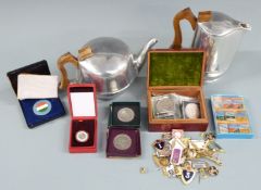 Collection of military badges including French, British and Russian, together with a Picquot ware