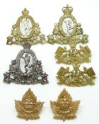Seven Canadian Army Royal Canadian Corps of Signals metal badges including a pair of collar badges