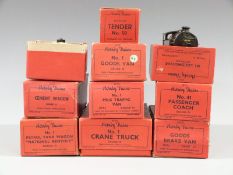 Nine Hornby 0 gauge clockwork tinplate locomotives, wagons, coaches, trucks and vans including a
