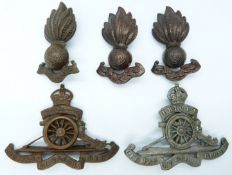 Two British Army metal badges including three collar badges