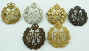 Six RAF metal cap badges
