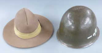American steel helmet circa Vietnam era together with a felt Gurkha hat
