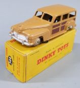 Dinky Toys diecast model Estate Car with brown body and cream hubs, 344, in original box.
