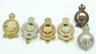Six Northumberland Hussars metal cap badges including two by Gaunt London / Birmingham