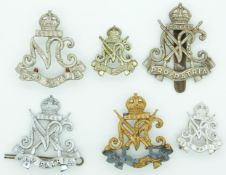 Six South Africa Royal Natal Carabineers metal badges