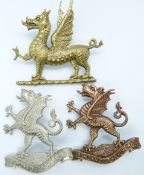 Two British Army Monmouthshire Regiment metal hat badges