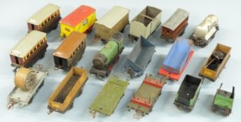Eighteen Hornby 0 gauge locomotives and rolling stock comprising clockwork tender locomotive with