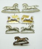 Seven British Army 3rd King's Own Hussars metal collar badges in three pairs plus one
