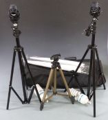 Two photography studio lights with umbrella style reflectors and tripods, in carry bag