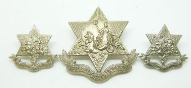 Three Barbados Volunteers metal badges comprising a cap badge and two collar badges