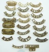 British Army a small collection of County Regiments metal shoulder titles including those for the