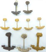 Nine Royal West African Frontier Force metal badges including officer's examples