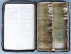 Cased glass microscope slides, the case embossed to front microscopical preparations, the slides