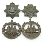 Four British Army Devon / Dorset Regiment bronze cap badges