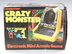 Grandstand Crazy Monster tabletop electronic mini arcade game, in original box.