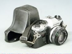 Olympus OM-10 SLR camera with 50mm 1:1.8 lens