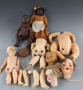 A collection of dolls and doll parts including bisque headed examples, one marked Germany 182 69.
