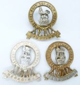 Three British Army 15th/19th Hussars metal cap badges including an other ranks bi-metal example