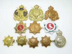 Eleven Guyana and British Guyana military metal badges including an enamelled example and two