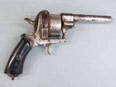 A 12mm pinfire 8-shot double action percussion hammer action revolver with engraved frame, shaped
