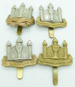 Four British Army Cambridgeshire Regiment ranks cap badges including a double scroll example