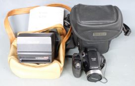 Fujifilm S5700 digital camera and a Polaroid autofocus 660 camera
