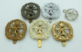 Six British Army Small Arms School metal badges including a King's Crown example by Firmin and a